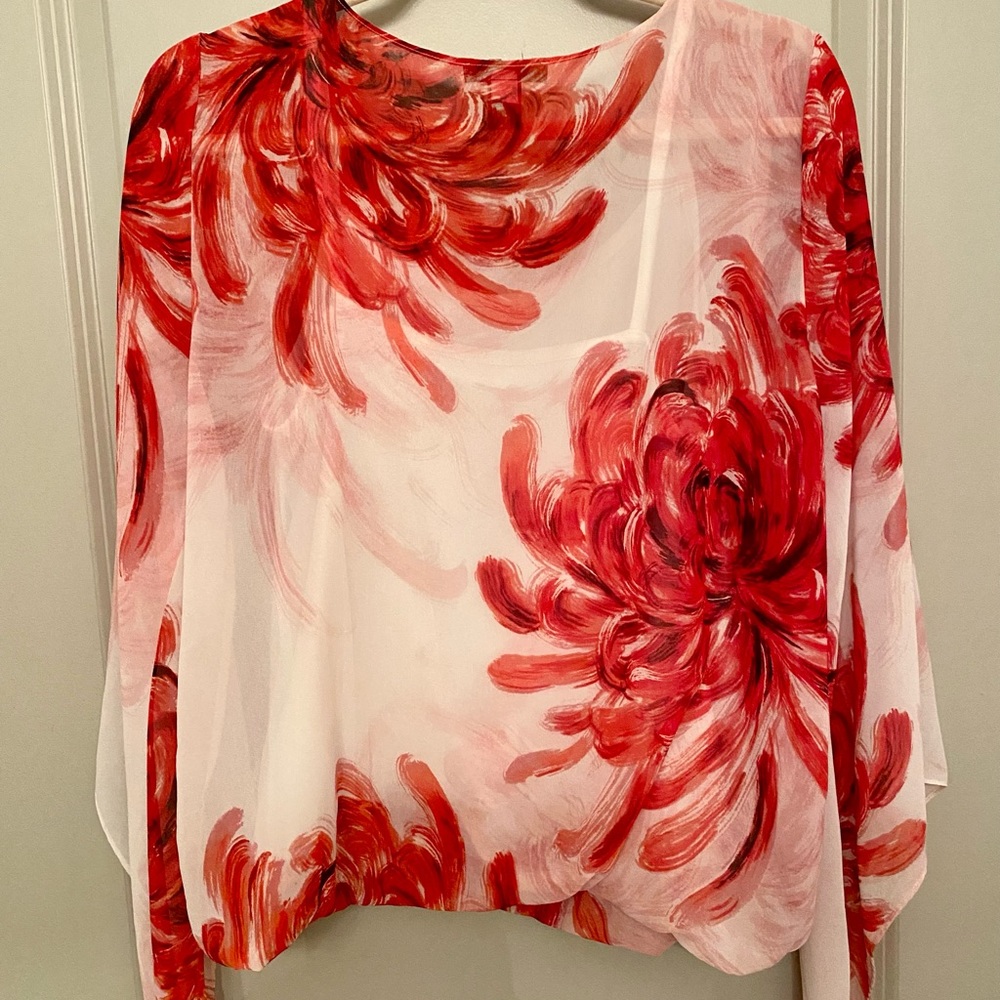 Alfani blouse with red, black, and white swirl design